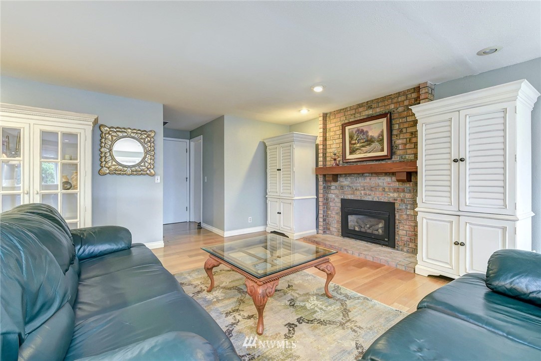 23814 23rd Drive Southeast Bothell, WA 98021 - Photo 7 of 26 a living room with furniture and a fireplace