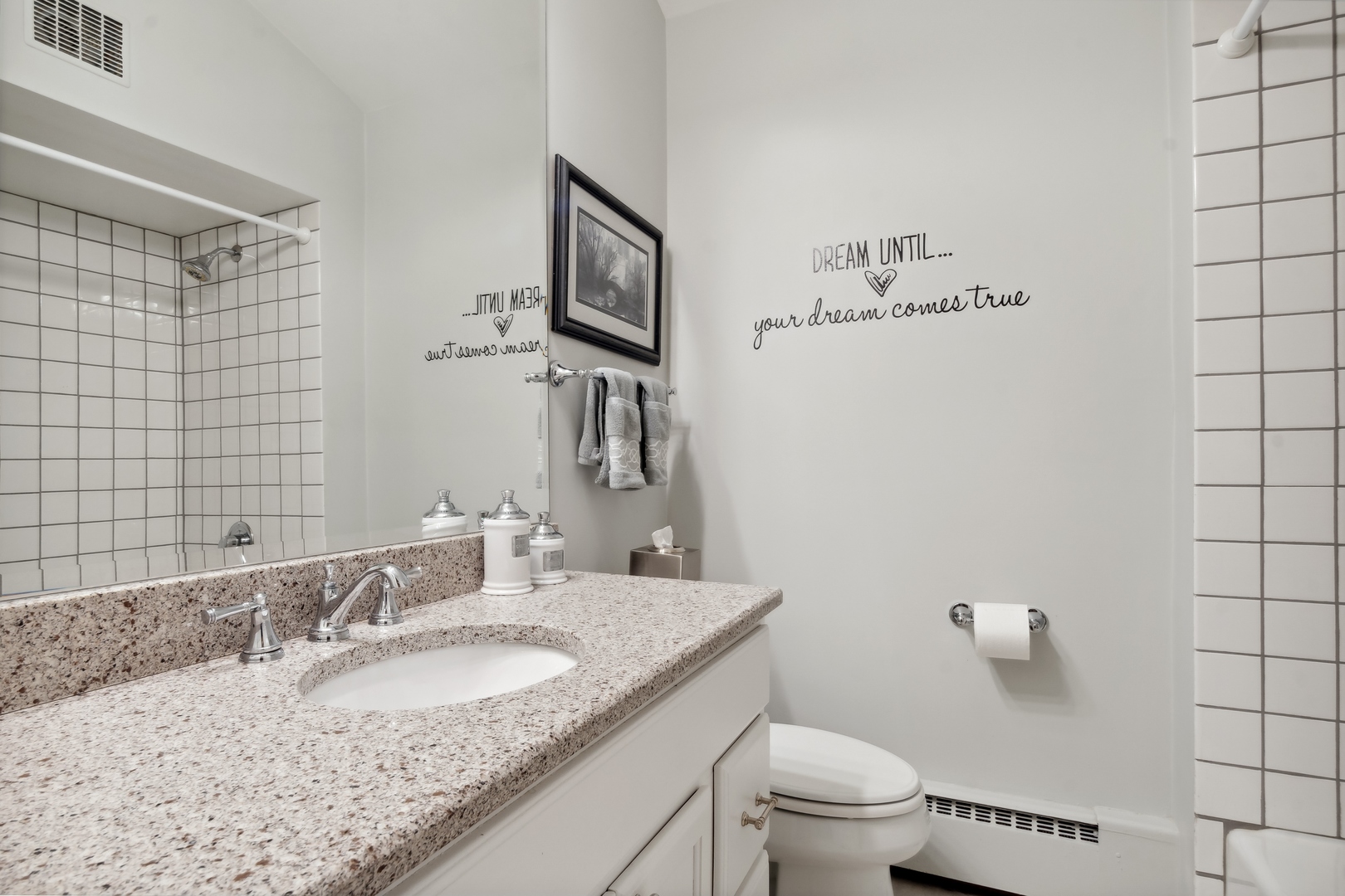 707 Westgate Road Deerfield, IL 60015 - Photo 20 of 33 a bathroom with a granite countertop sink a toilet and a mirror
