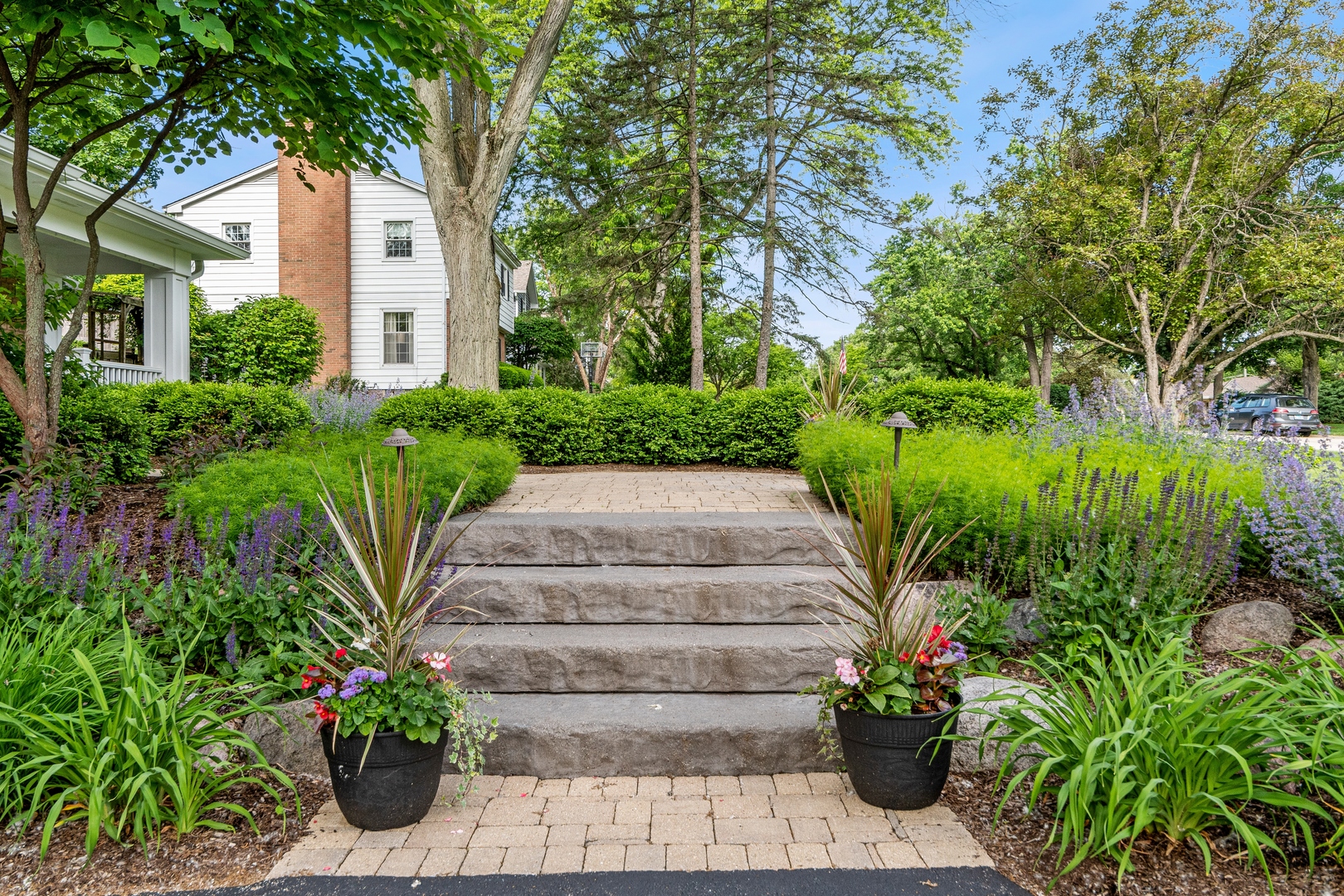 707 Westgate Road Deerfield, IL 60015 - Photo 2 of 33 a view of a garden with potted plants