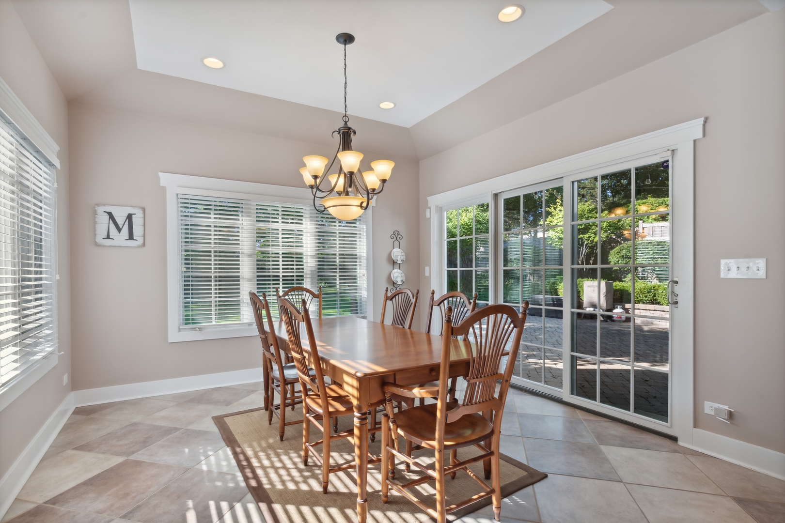 707 Westgate Road Deerfield, IL 60015 - Photo 9 of 33 a dining room with furniture large windows and a chandelier