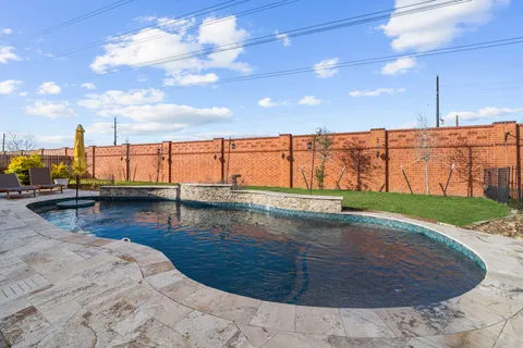 a view of swimming pool with outdoor seating