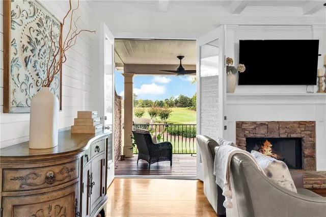 a living room with fireplace furniture and a flat screen tv