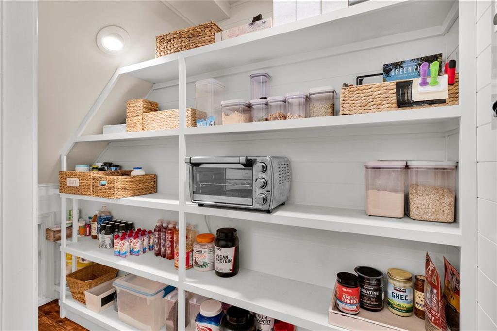 3138 Neal Court Cumming, GA 30041 - Photo 17 of 52 a cabinet with granite countertop lots of different kinds of food