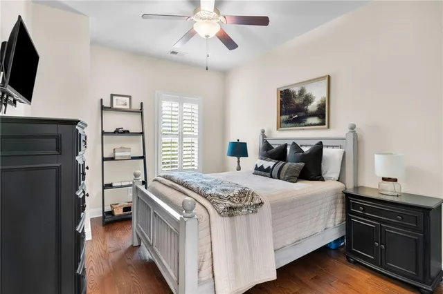 a view of bedroom with furniture and wooden floor