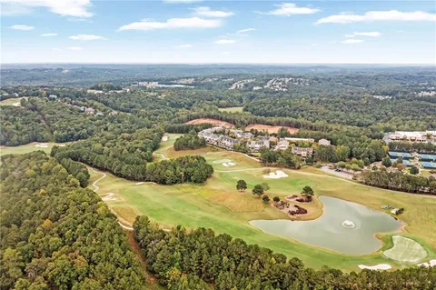 an aerial view of a house with outdoor space pool seating area and yard