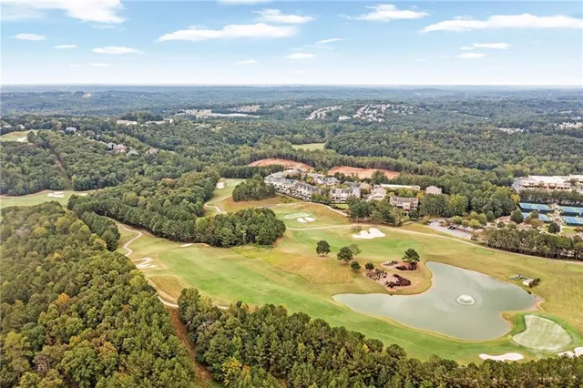 an aerial view of a house with outdoor space pool seating area and yard