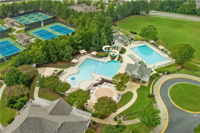 an aerial view of a house with a ocean view