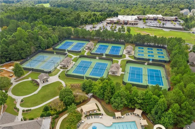 an aerial view of residential house with outdoor space and swimming pool
