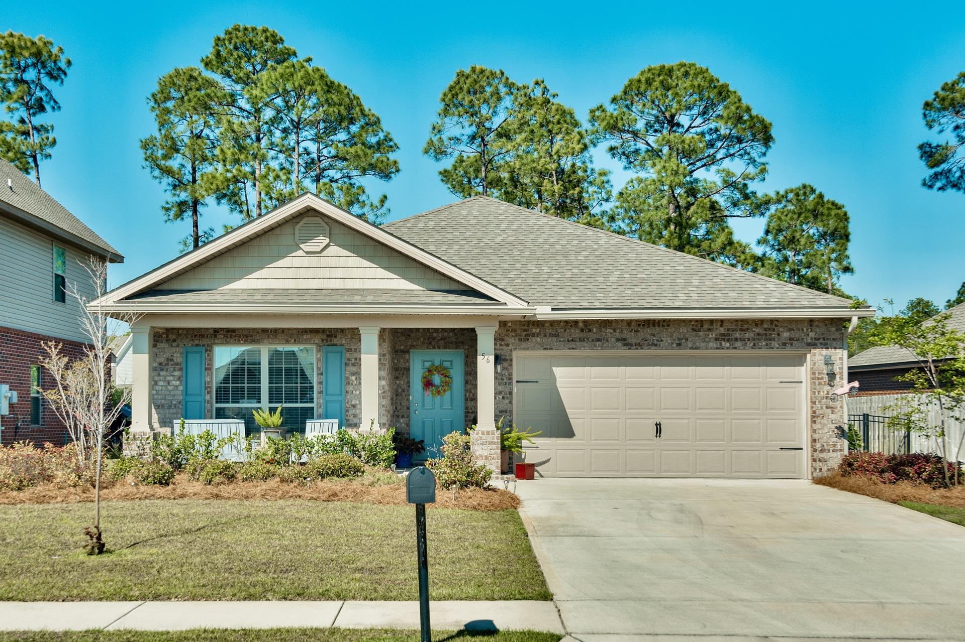 56 Pin Oak Loop Santa Rosa Beach, FL 32459 - Photo 1 of 27 a front view of a house with garden
