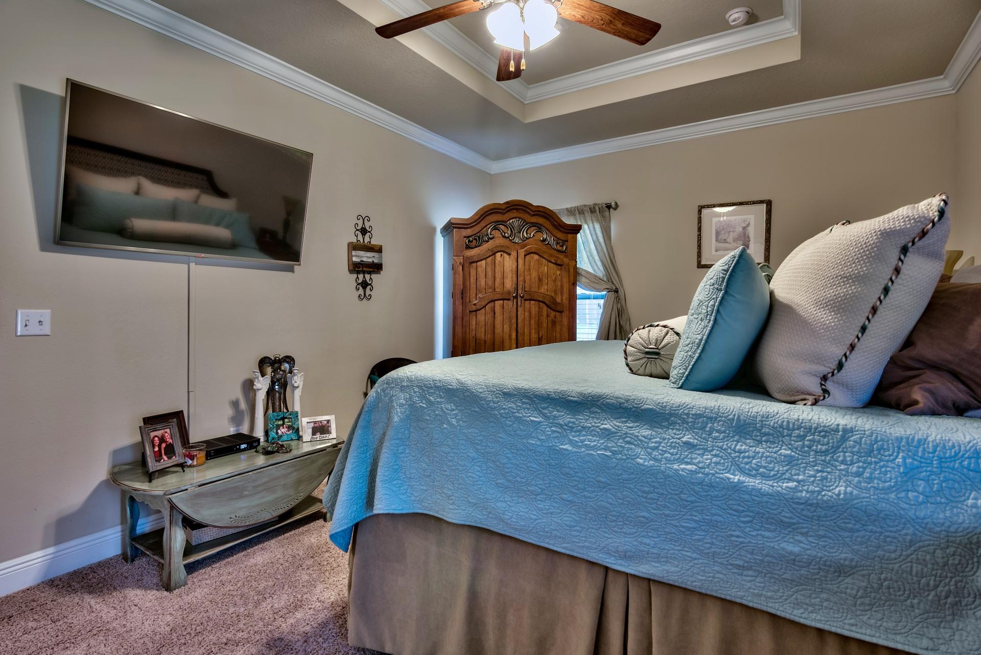 56 Pin Oak Loop Santa Rosa Beach, FL 32459 - Photo 14 of 27 a bedroom with a bed and flat screen tv