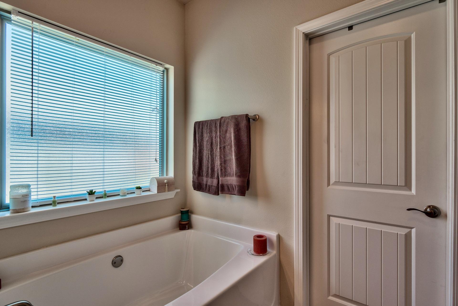 56 Pin Oak Loop Santa Rosa Beach, FL 32459 - Photo 16 of 27 a bathroom with a tub and a window