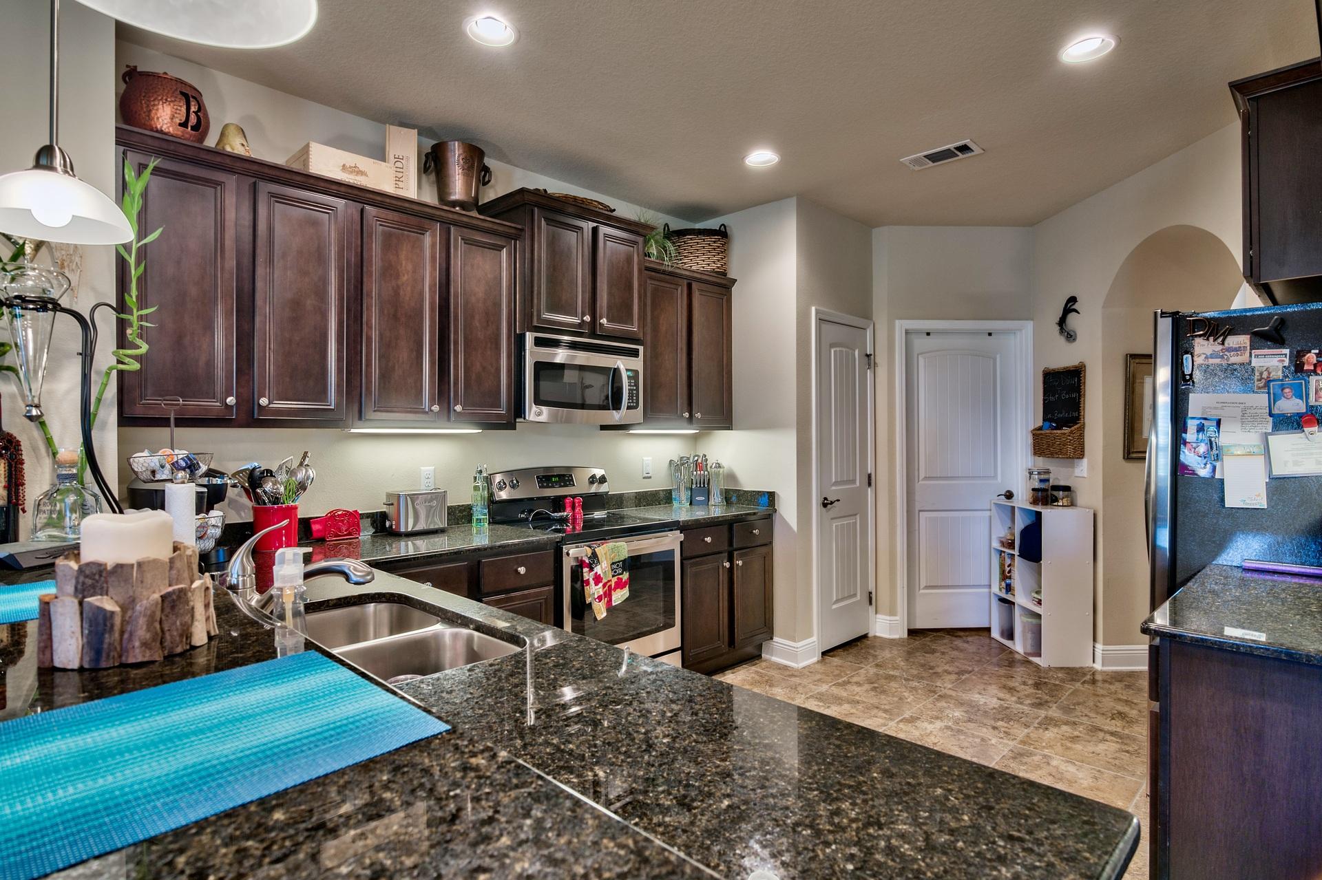 56 Pin Oak Loop Santa Rosa Beach, FL 32459 - Photo 8 of 27 a kitchen with stainless steel appliances granite countertop a refrigerator stove and sink
