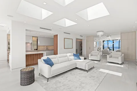 a living room with furniture and white walls