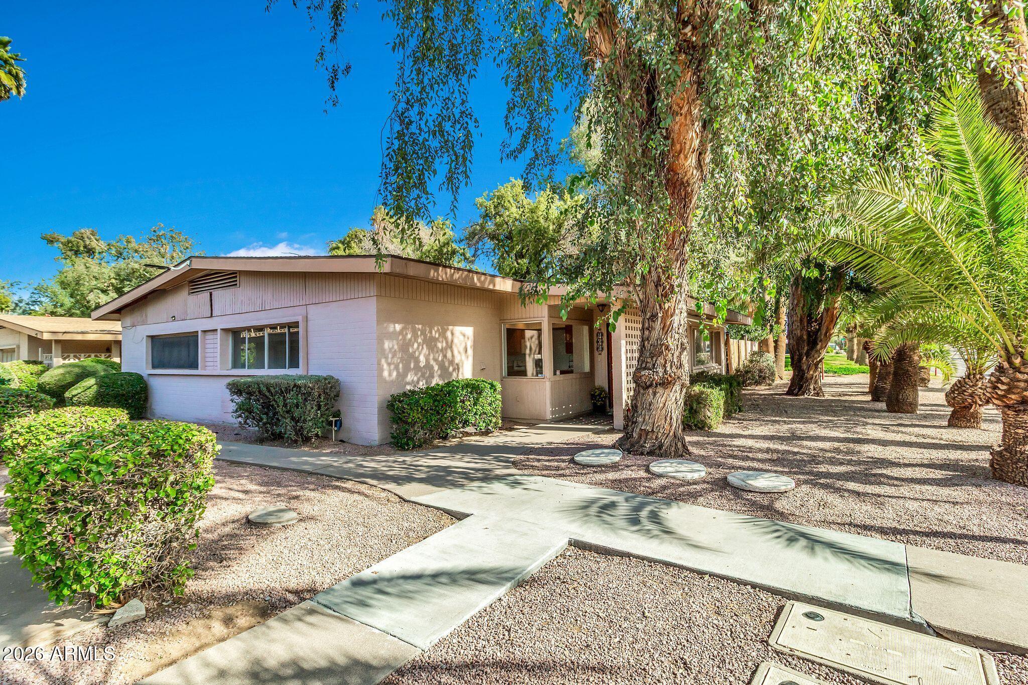 725 South Power Road, Unit 101 Mesa, AZ 85206 - Photo 11 of 38 a front view of house with yard and green space