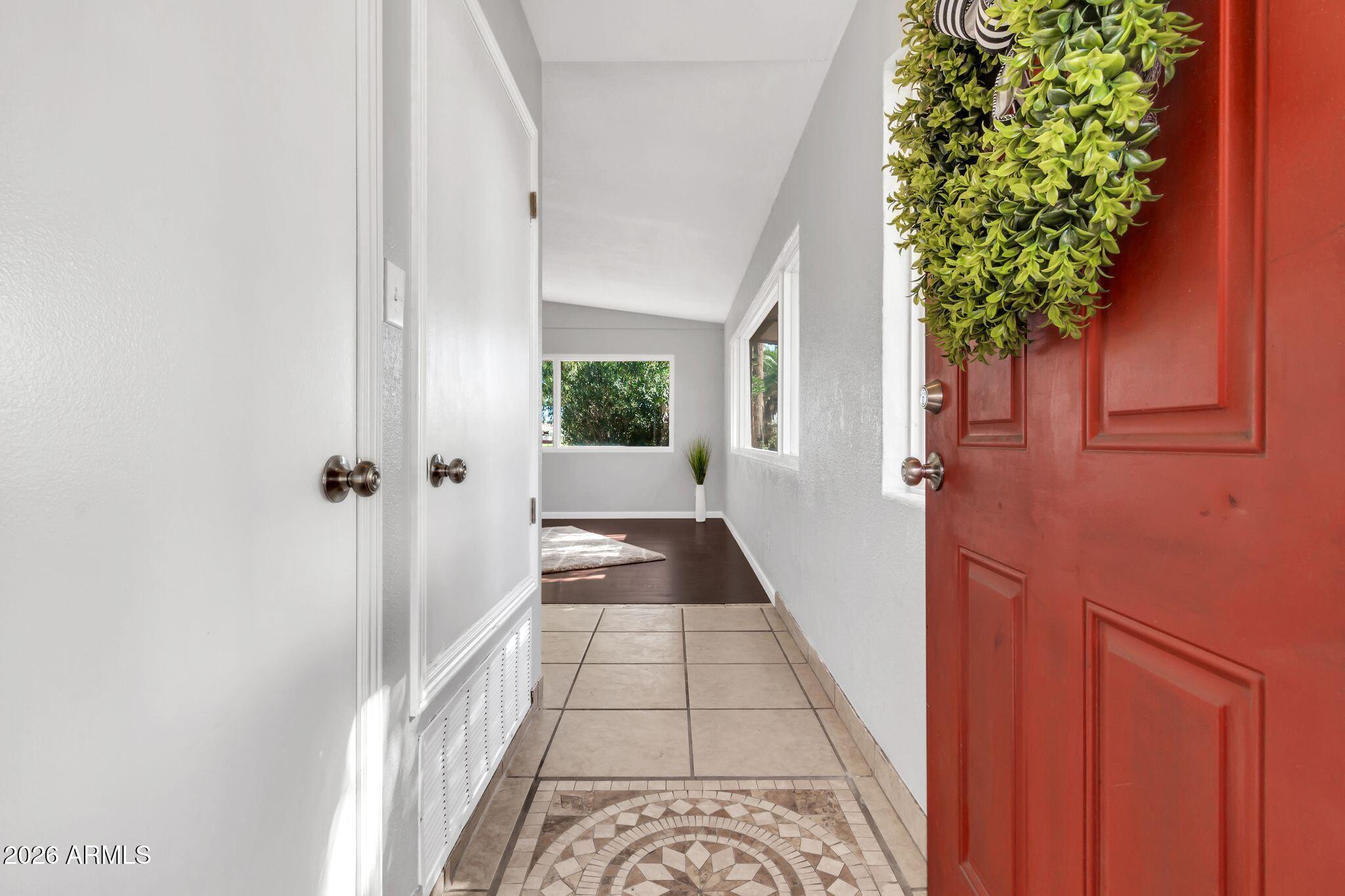 725 South Power Road, Unit 101 Mesa, AZ 85206 - Photo 13 of 38 wooden floor with a potted plant in front of a door
