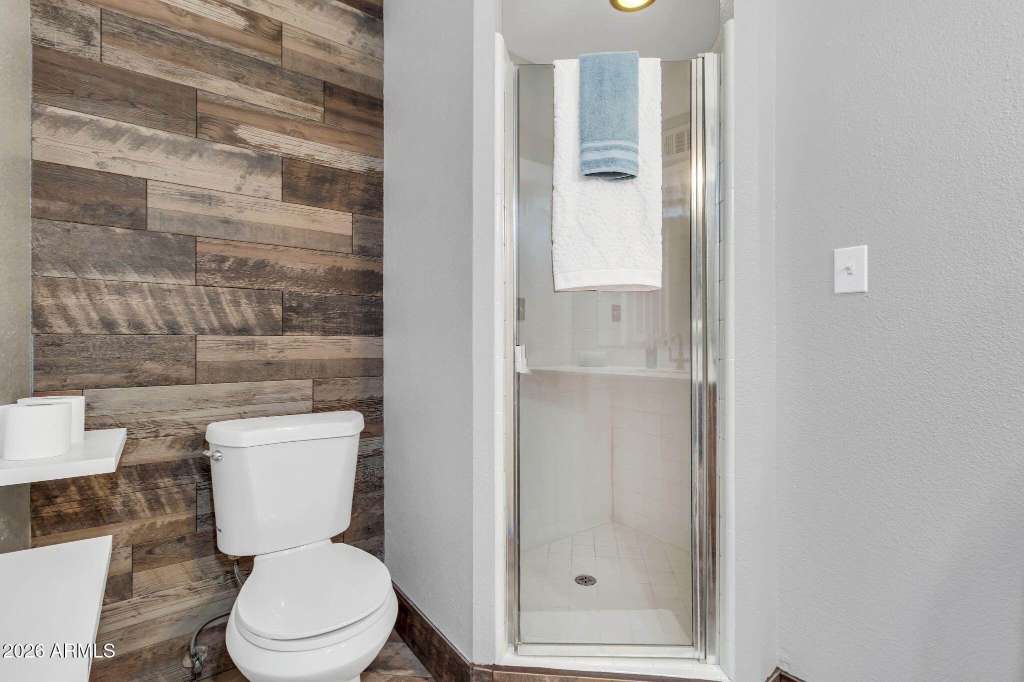 725 South Power Road, Unit 101 Mesa, AZ 85206 - Photo 26 of 38 a white toilet sitting next to a bathroom sink