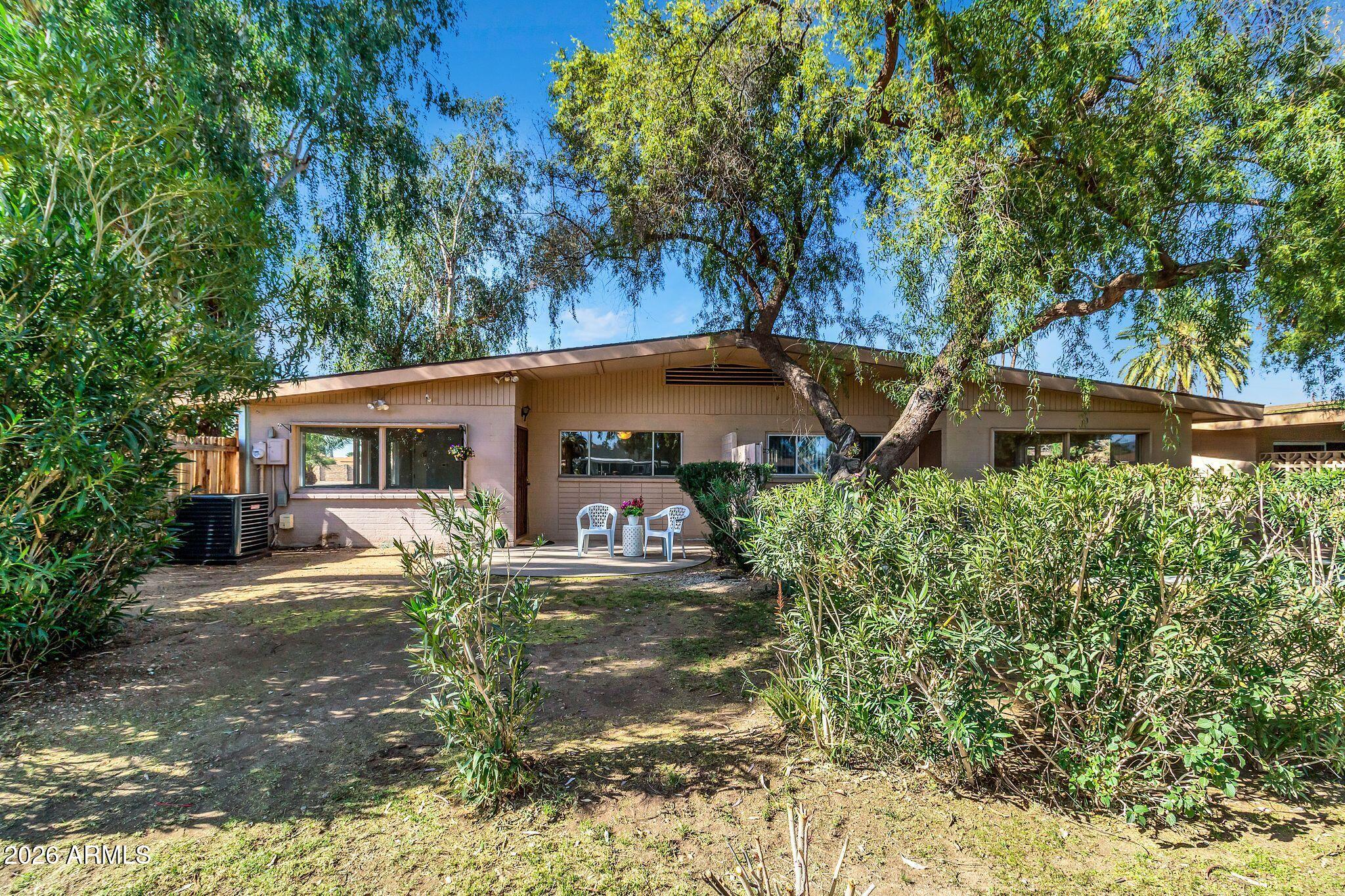 725 South Power Road, Unit 101 Mesa, AZ 85206 - Photo 36 of 38 front view of a house with a yard