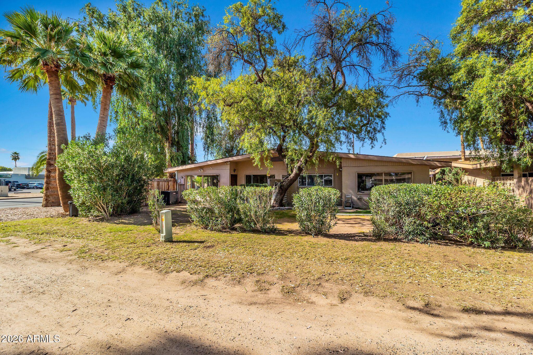 725 South Power Road, Unit 101 Mesa, AZ 85206 - Photo 37 of 38 a front view of a house with a yard
