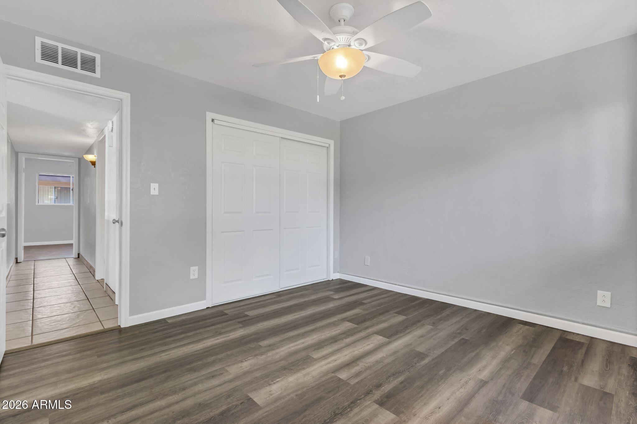 725 South Power Road, Unit 101 Mesa, AZ 85206 - Photo 4 of 38 wooden floor in an empty room
