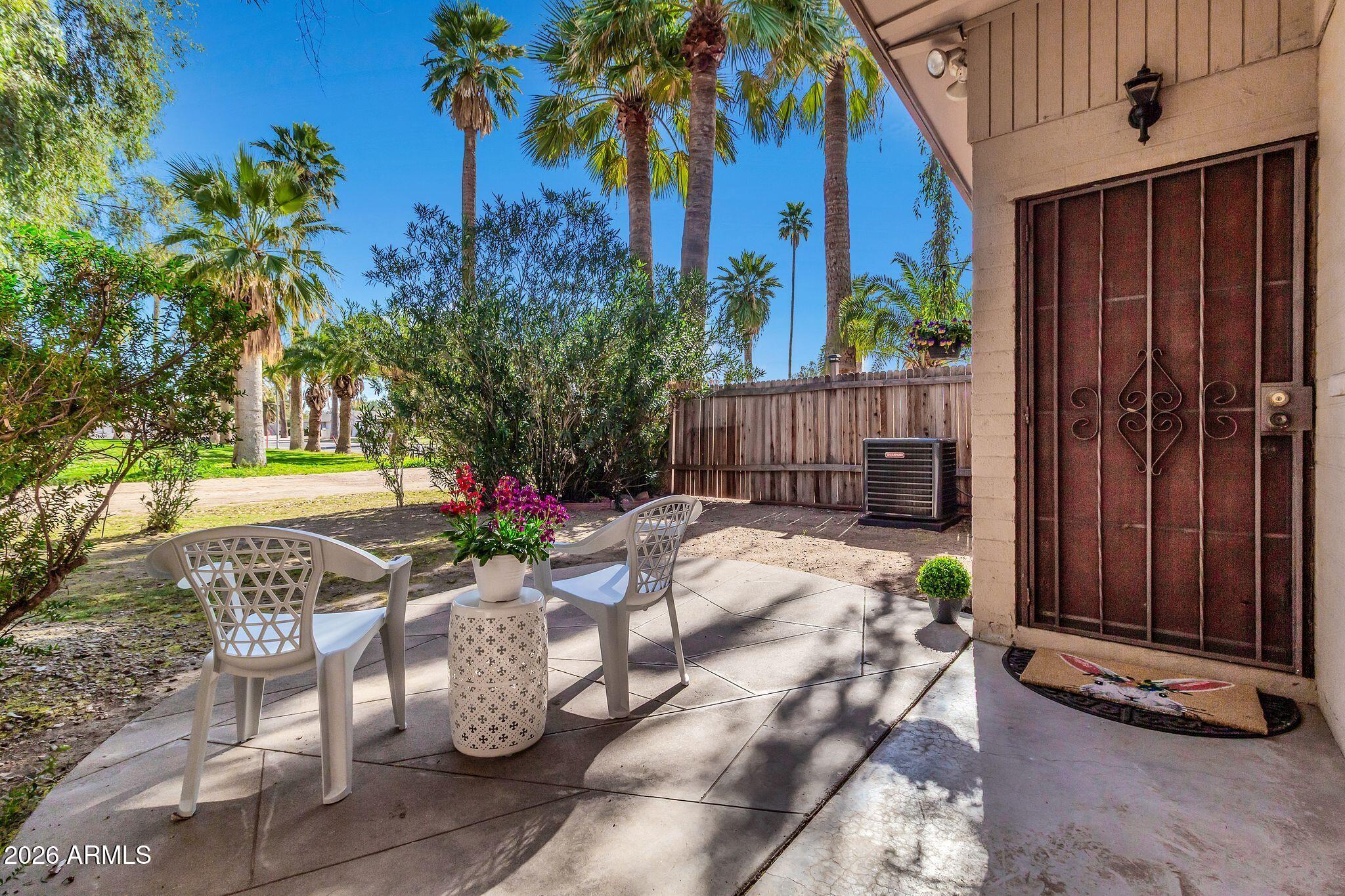 725 South Power Road, Unit 101 Mesa, AZ 85206 - Photo 8 of 38 a view of a backyard with sitting area
