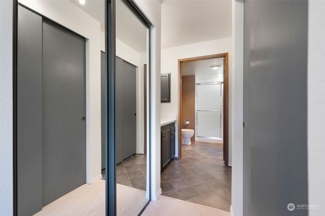 a view of a bathroom with a tub and shower