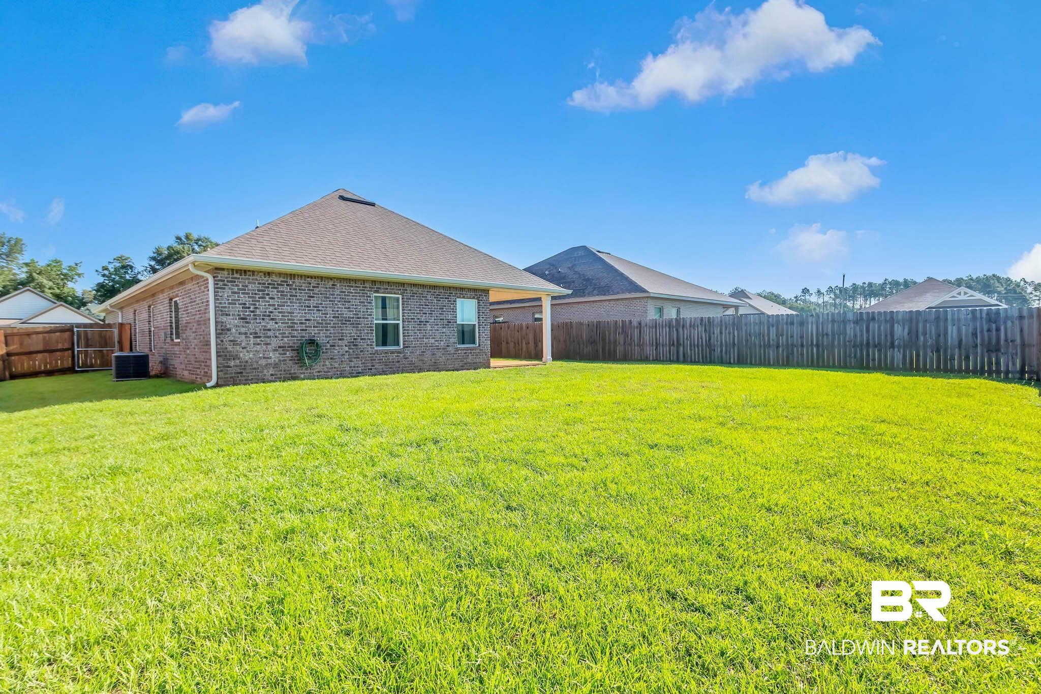16461 Prado Loop Loxley, AL 36551 - Photo 62 of 78 Fenced backyard featuring a patio