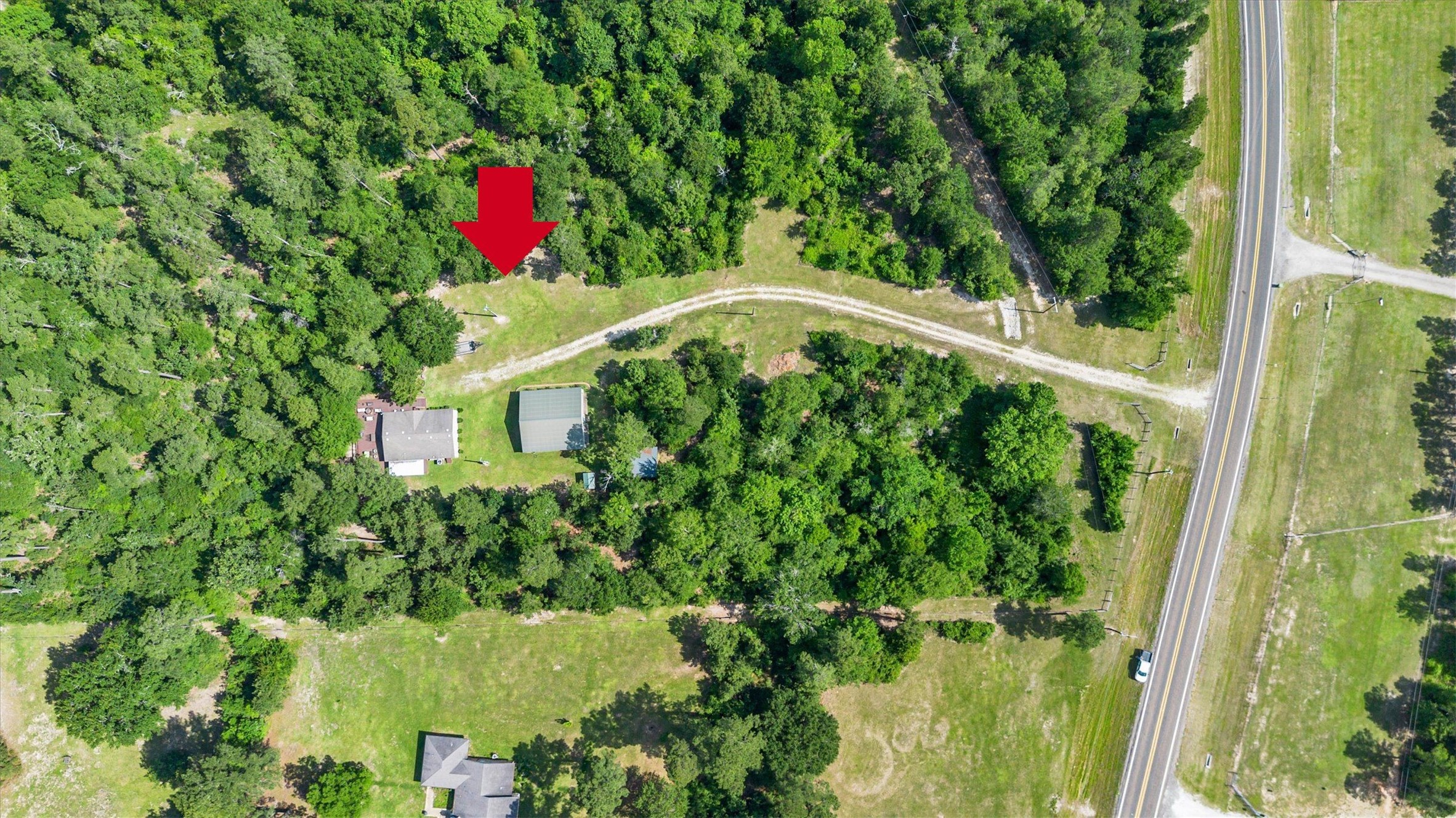 50 Fm 3179 Road Huntsville, TX 77320 - Photo 45 of 45 Expansive aerial perspective showcases the property’s privacy and beautiful countryside setting.