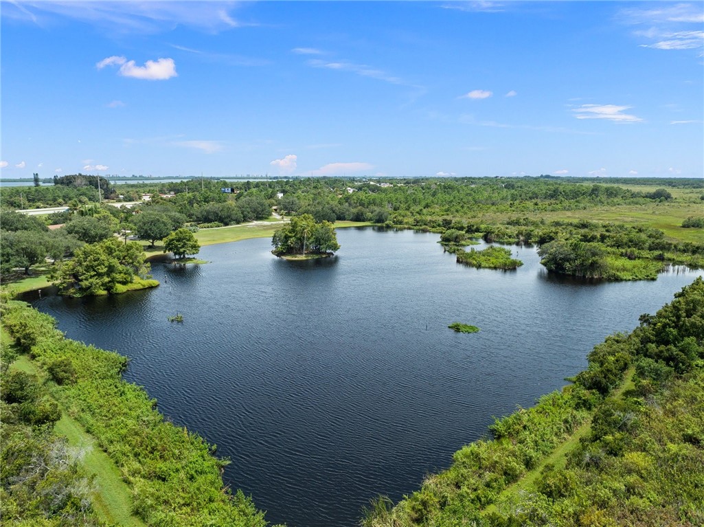 5051 Tozour Road Fort Pierce, FL 34946 - Photo 12 of 31 a view of a lake with houses