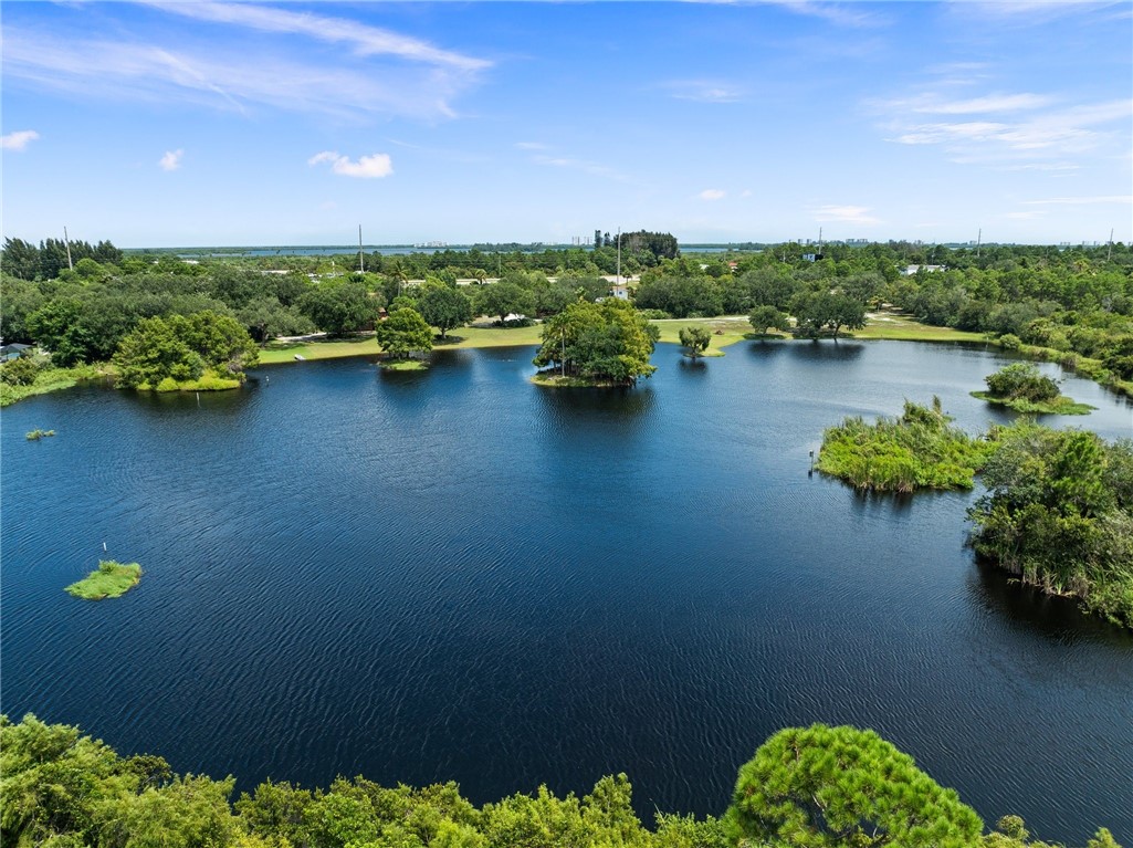 5051 Tozour Road Fort Pierce, FL 34946 - Photo 15 of 31 a view of a lake with a house