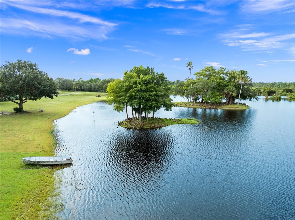 5051 Tozour Road Fort Pierce, FL 34946 - Photo 16 of 31 a view of a lake with houses