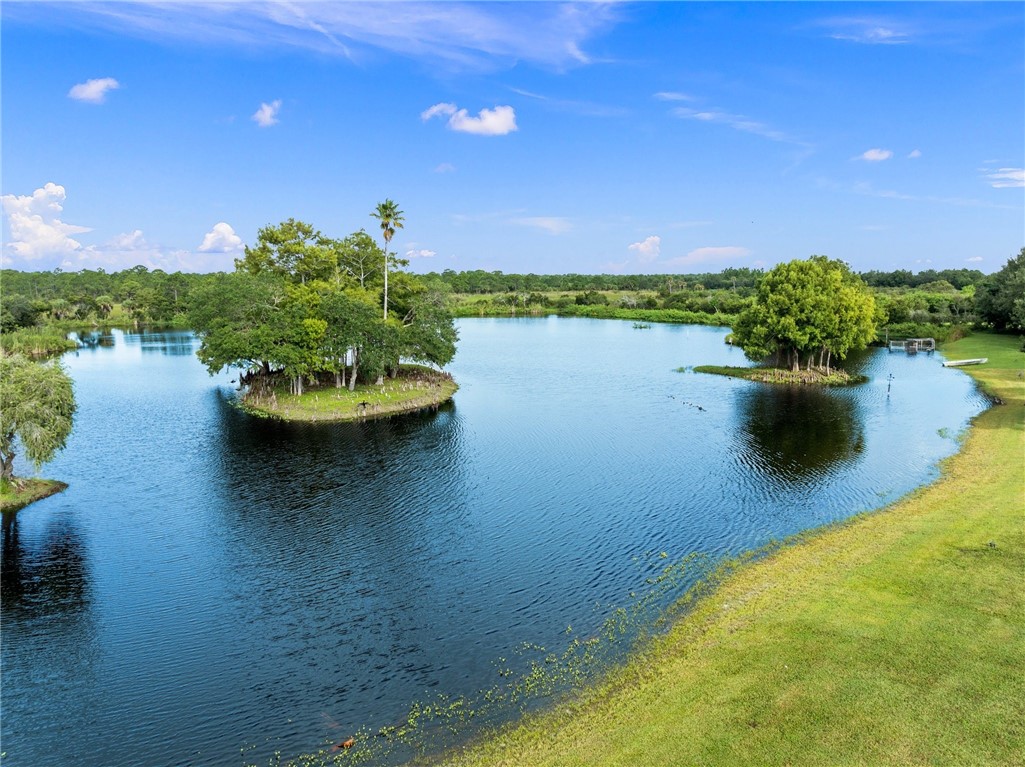 5051 Tozour Road Fort Pierce, FL 34946 - Photo 20 of 31 a view of a lake with a outdoor space