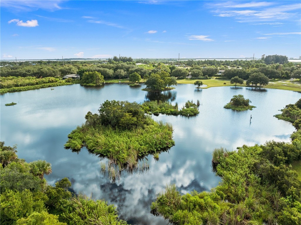 5051 Tozour Road Fort Pierce, FL 34946 - Photo 22 of 31 a view of a lake with a city