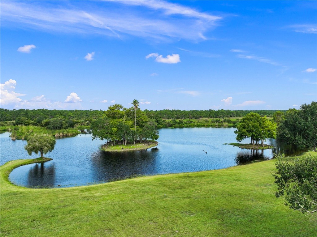 5051 Tozour Road Fort Pierce, FL 34946 - Photo 24 of 31 a view of a lake with a yard