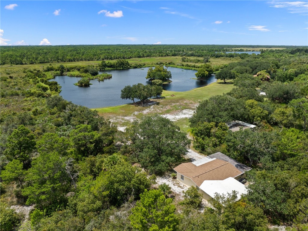 5051 Tozour Road Fort Pierce, FL 34946 - Photo 28 of 31 a view of a lake with a yard