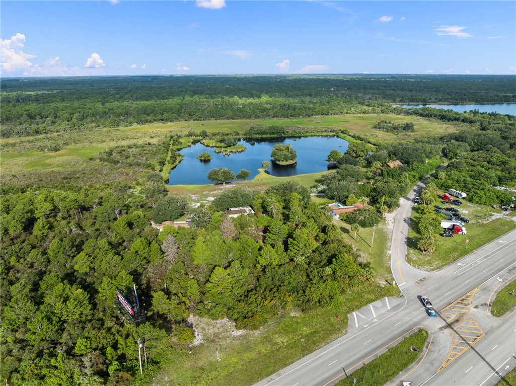 5051 Tozour Road Fort Pierce, FL 34946 - Photo 29 of 31 a view of a garden with a building in the background