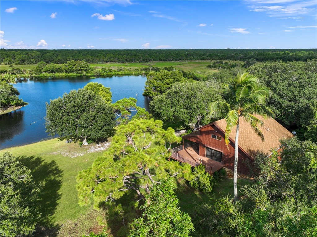 5051 Tozour Road Fort Pierce, FL 34946 - Photo 4 of 31 a view of a lake with a yard