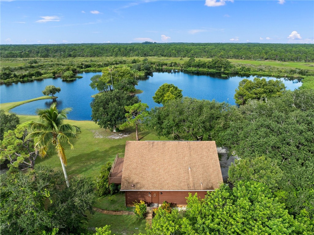 5051 Tozour Road Fort Pierce, FL 34946 - Photo 7 of 31 an aerial view of a house with a lake view