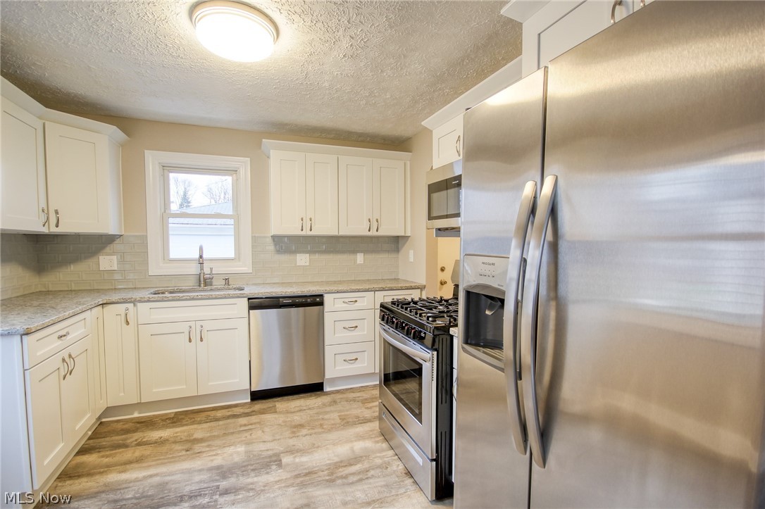 889 Quentin Road Eastlake, OH 44095 - Photo 6 of 18 New appliances, cabinetry, granite, sink, quality throughout...