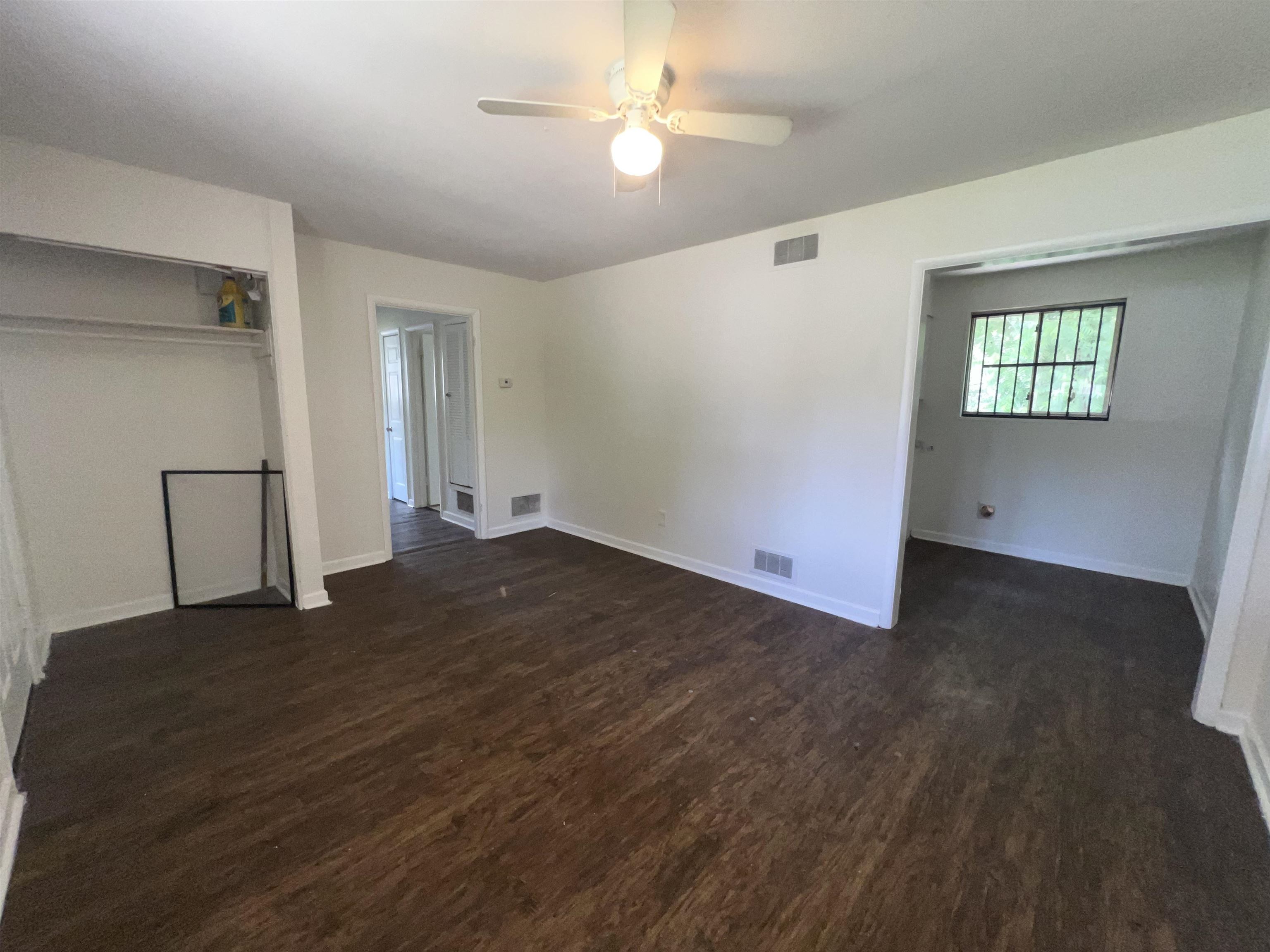 2235 Charjean Road Memphis, TN 38114 - Photo 3 of 15 Unfurnished bedroom with dark wood-type flooring, a closet, and ceiling fan