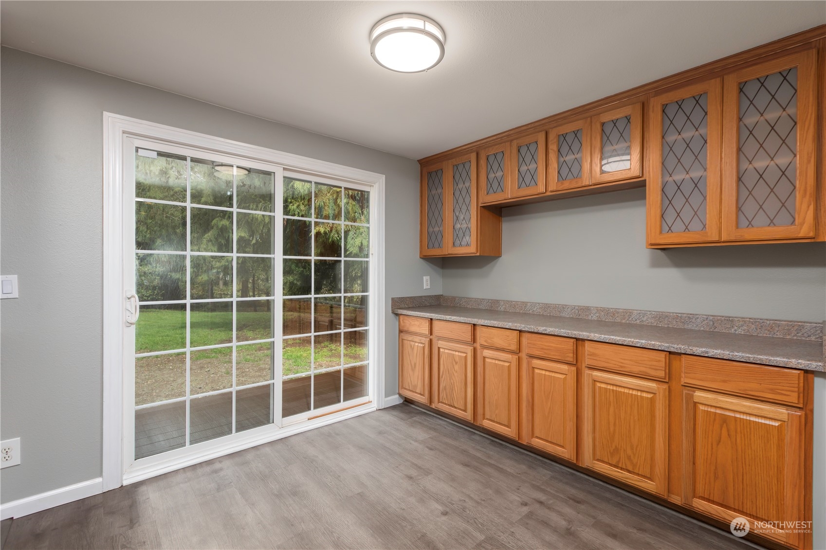 14092 Southeast 190th Street Renton, WA 98058 - Photo 11 of 27 a view of a kitchen with wooden floor and windows