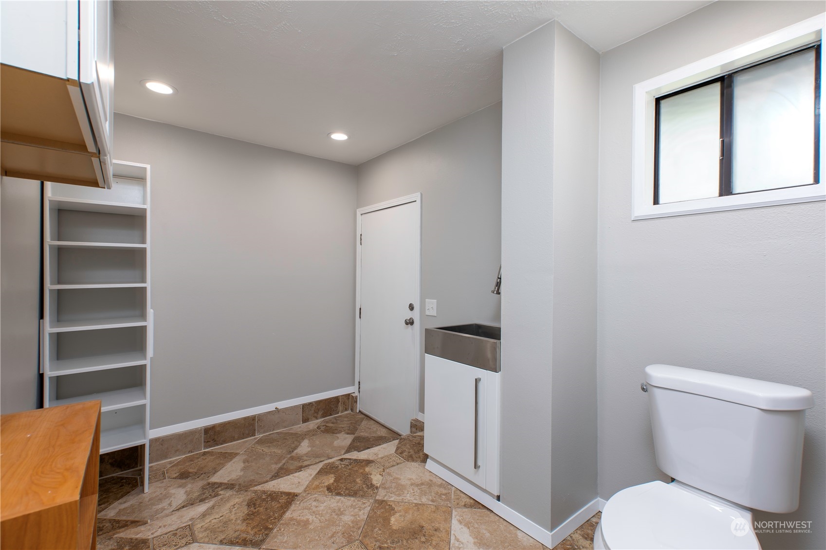 14092 Southeast 190th Street Renton, WA 98058 - Photo 15 of 27 a bathroom with a toilet a sink a vanity and mirror