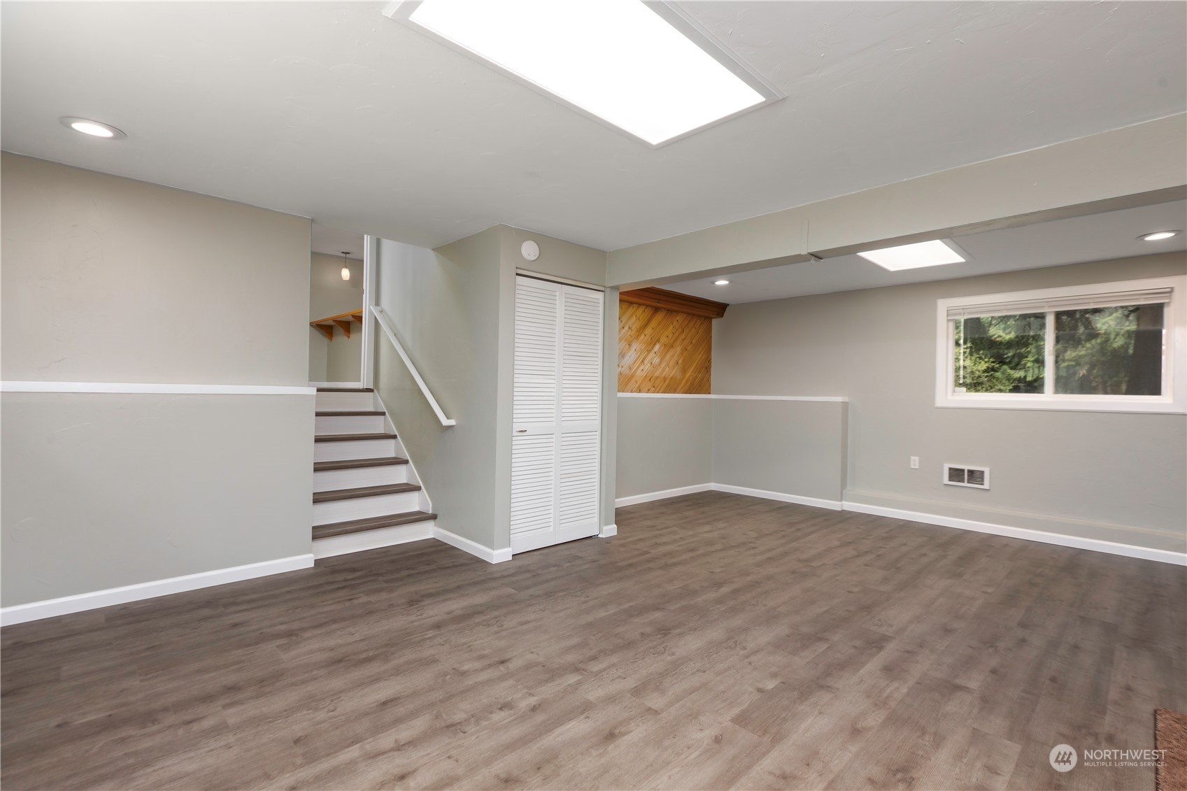 14092 Southeast 190th Street Renton, WA 98058 - Photo 16 of 27 a view of an empty room with wooden floor and a window