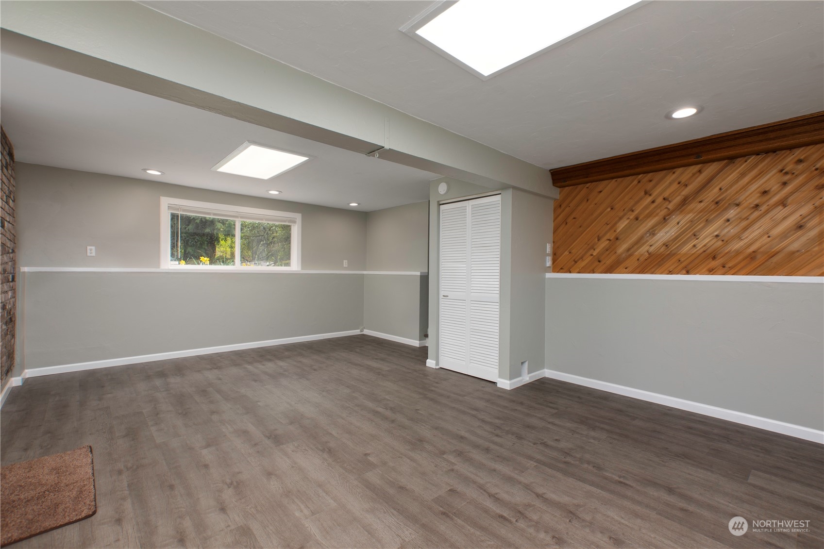 14092 Southeast 190th Street Renton, WA 98058 - Photo 17 of 27 an empty room with wooden floor and windows