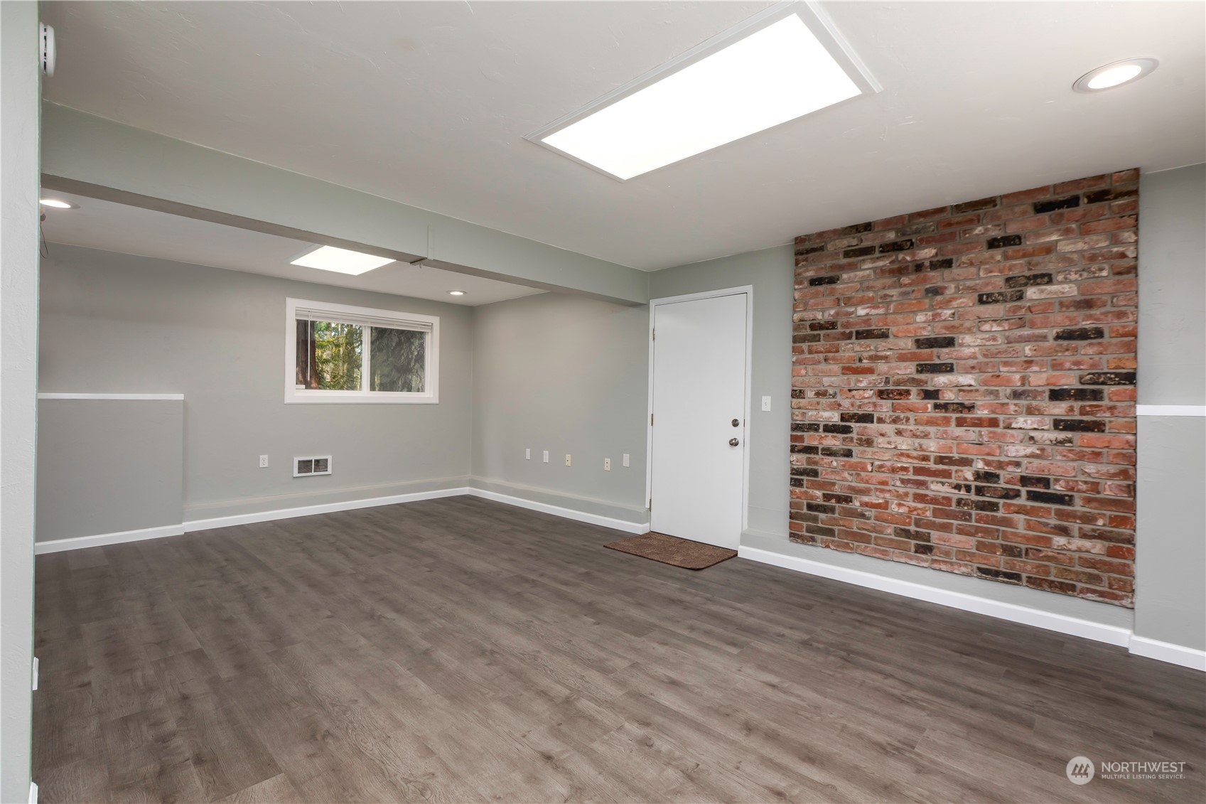 14092 Southeast 190th Street Renton, WA 98058 - Photo 18 of 27 wooden floor in an empty room with a window