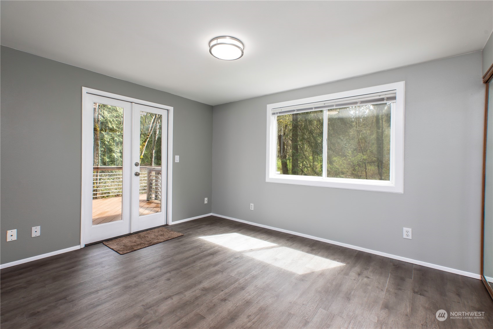 14092 Southeast 190th Street Renton, WA 98058 - Photo 20 of 27 an empty room with wooden floor and windows