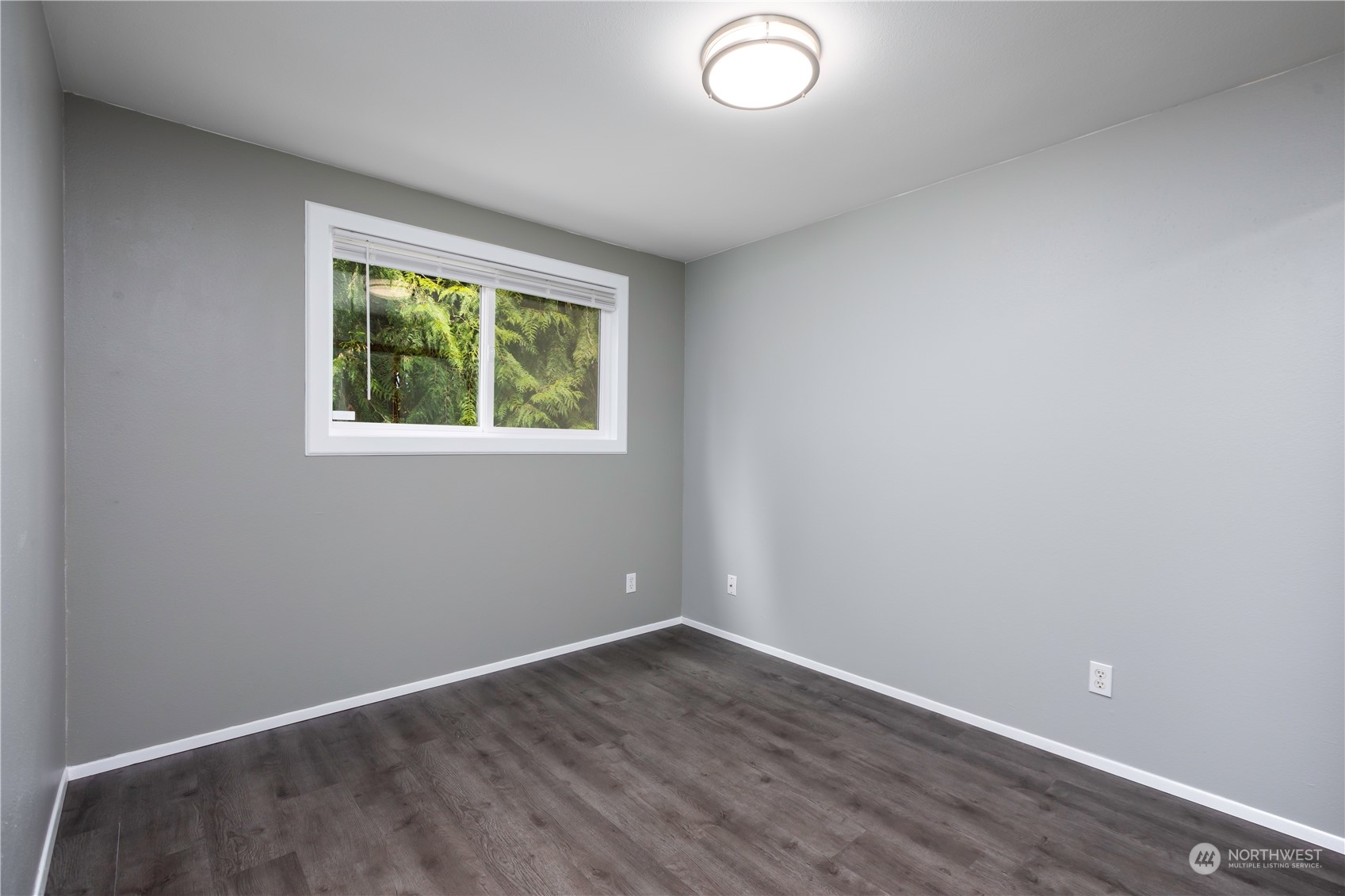 14092 Southeast 190th Street Renton, WA 98058 - Photo 22 of 27 an empty room with wooden floor and windows