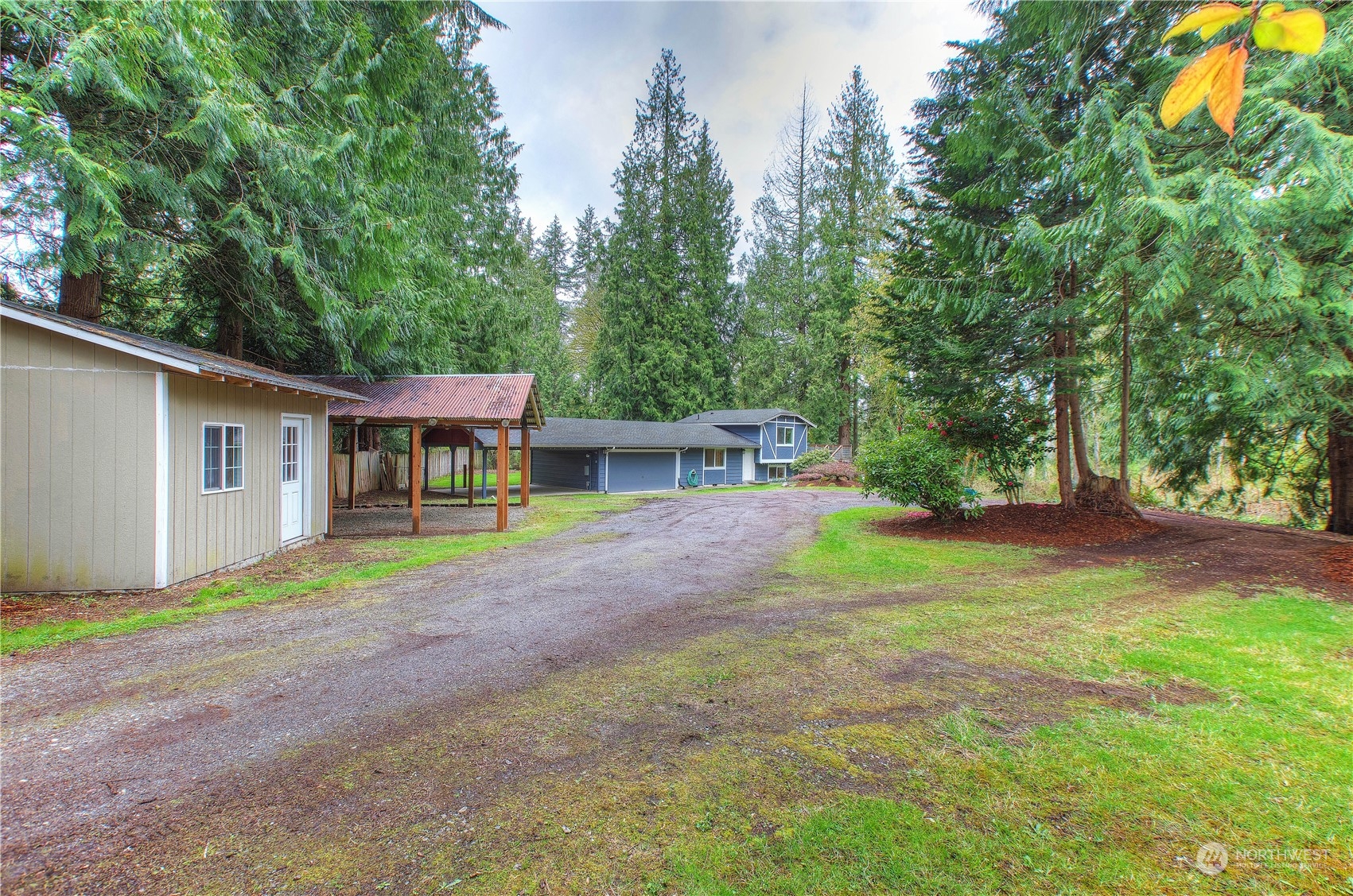 14092 Southeast 190th Street Renton, WA 98058 - Photo 4 of 27 a view of a house with backyard and a tree
