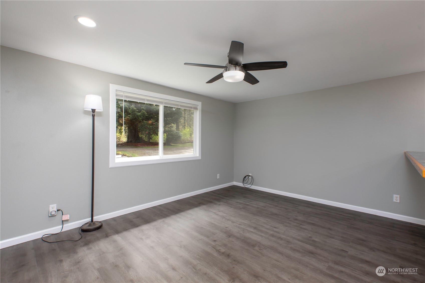 14092 Southeast 190th Street Renton, WA 98058 - Photo 9 of 27 a view of empty room with wooden floor and fan