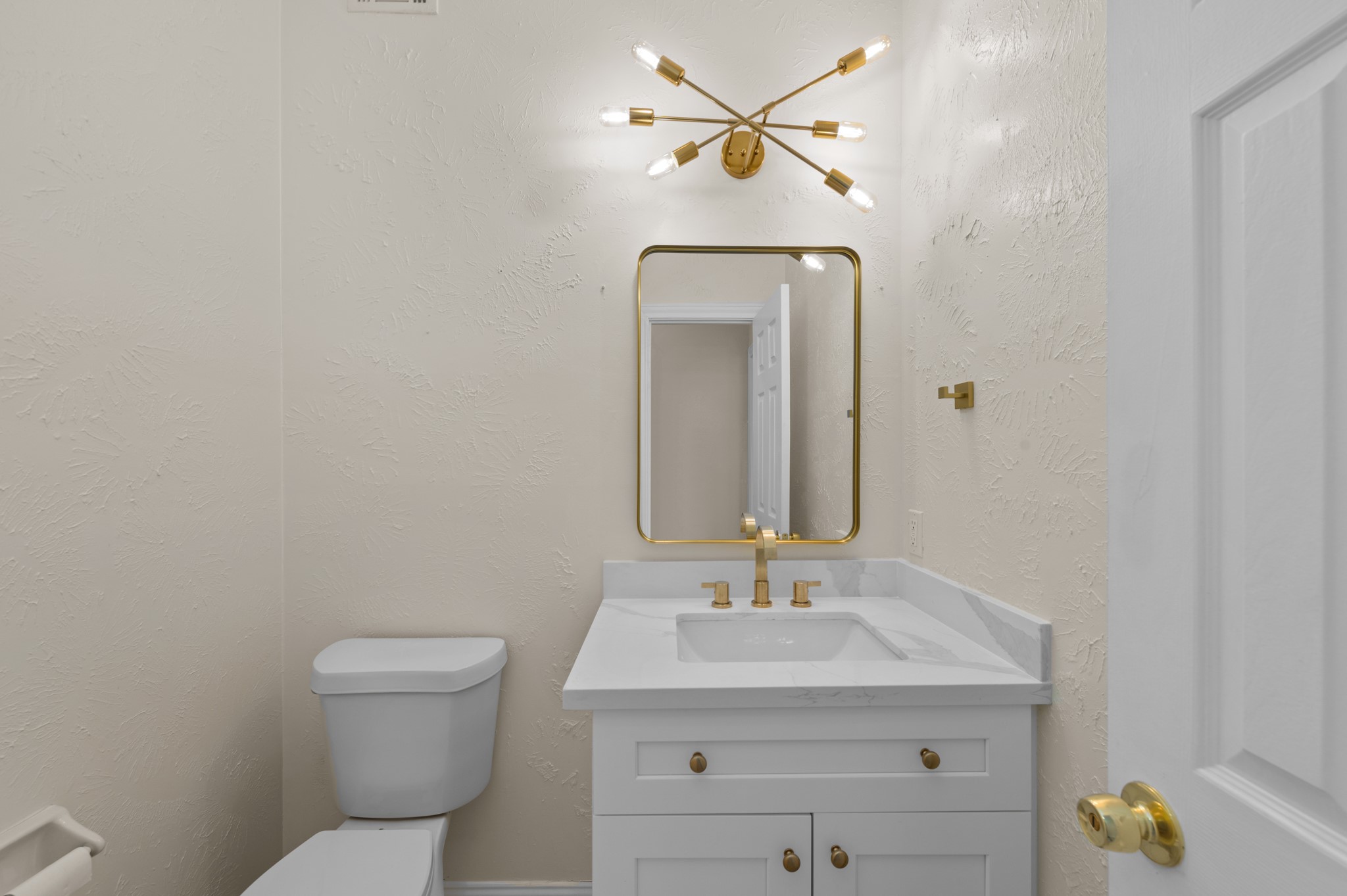 17402 Wilton Park Court Spring, TX 77379 - Photo 39 of 50 a bathroom with a toilet sink and mirror