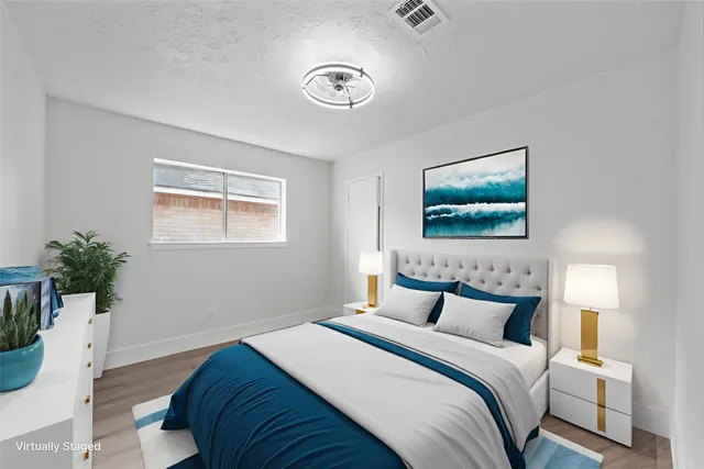 a bedroom with bed and a window